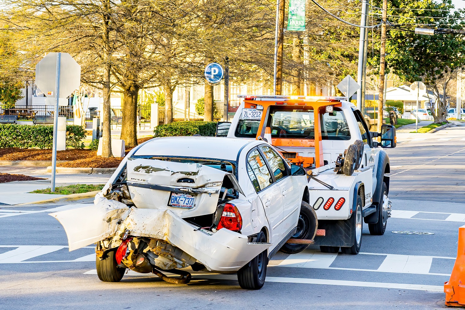 A Car is Towed Away by a Tow Truck.