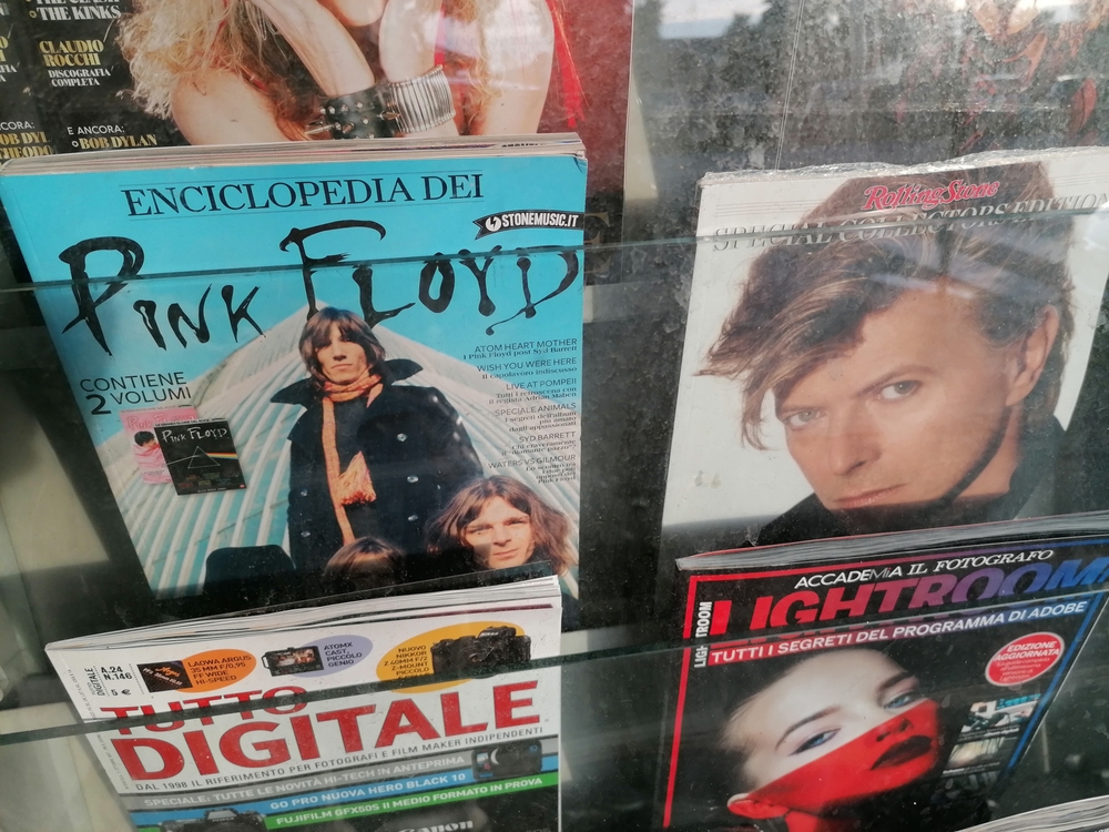 photography of magazines in a shop window