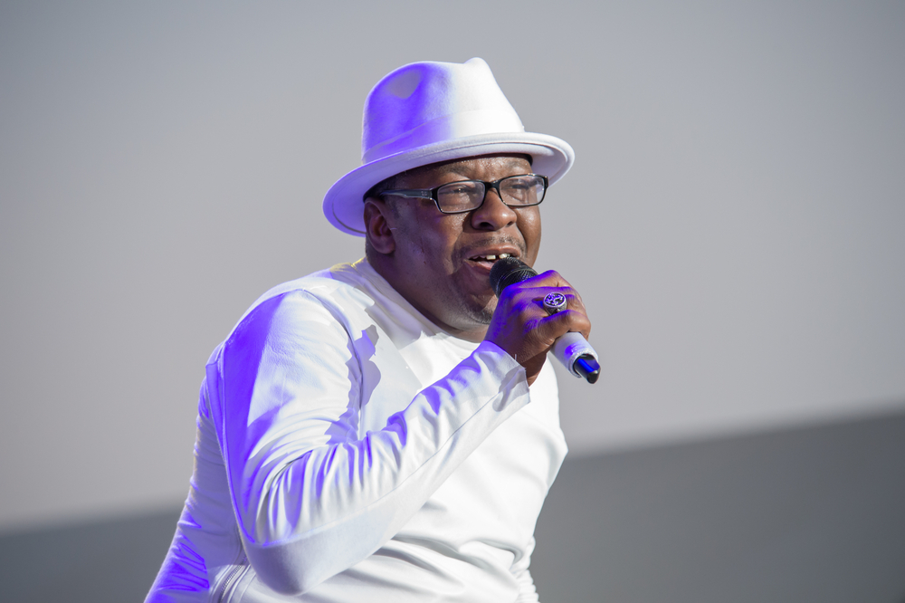 Bobby Brown of New Edition performs holding microphone