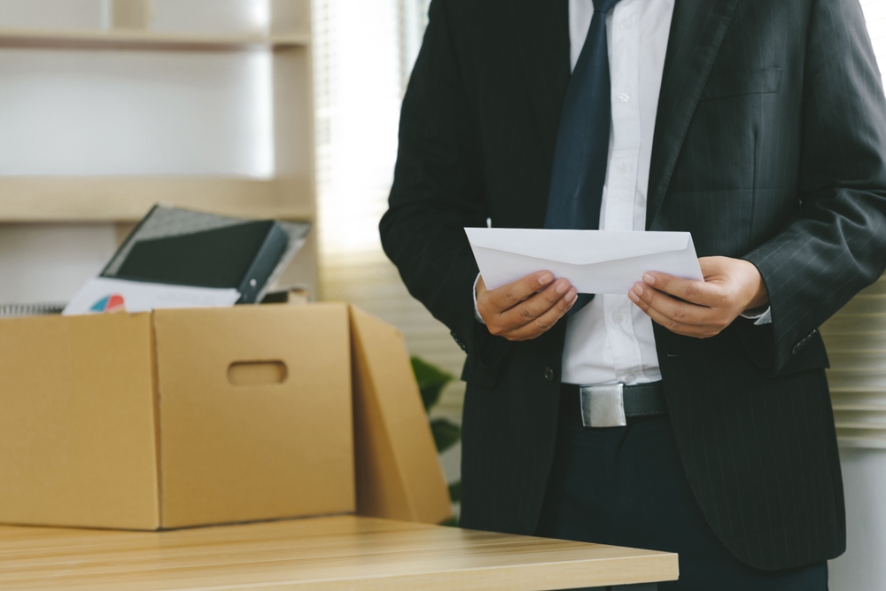 Employee holding a letter of resignation