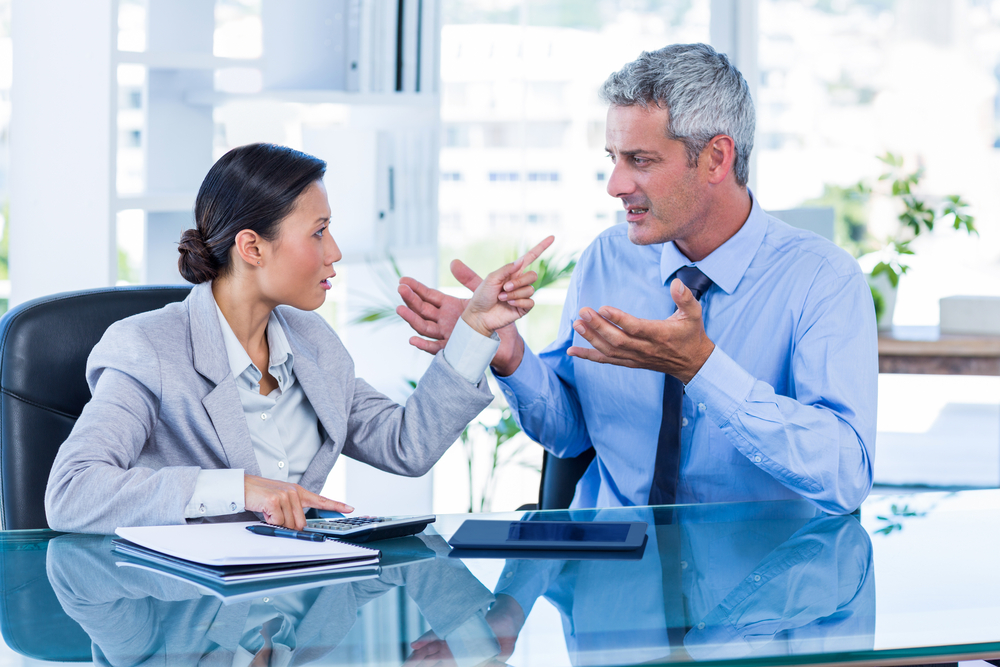 Business people having argument in office