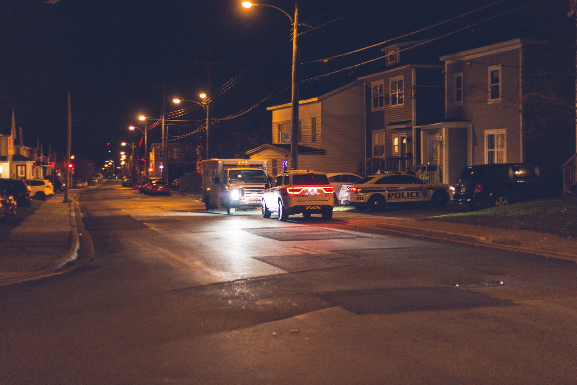 Police in front of a suburban house