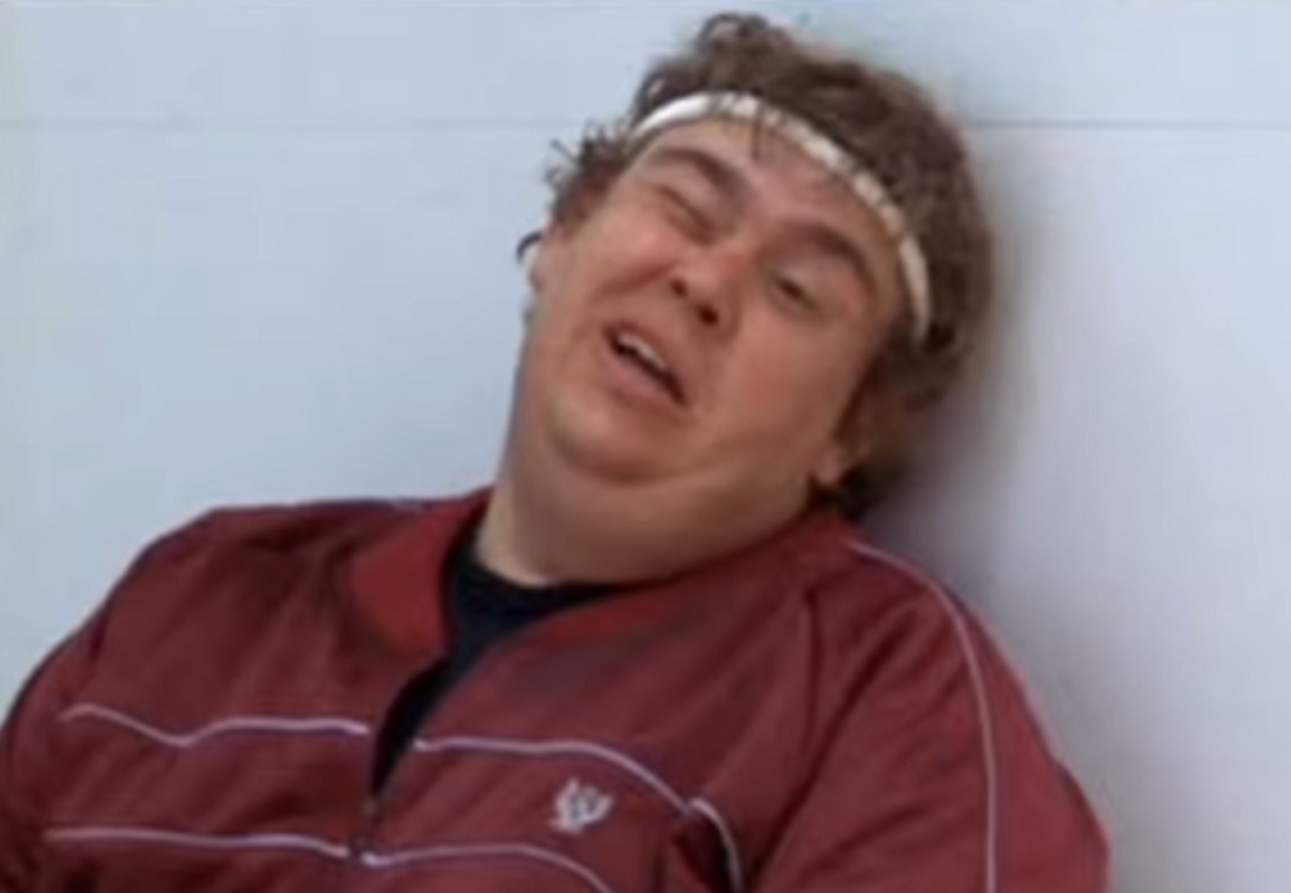 Screenshot :John Candy wearing red jacket is looking tired - from Splash (1984)