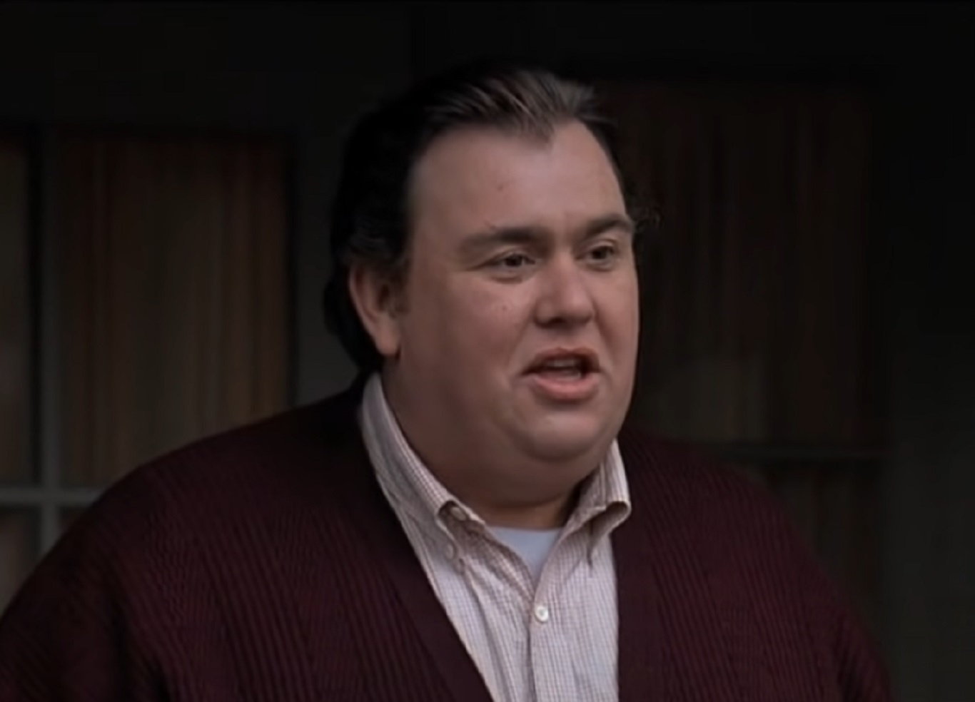 Screenshot :John Candy wearing beige shirt and red sweater - from Uncle Buck (1989)