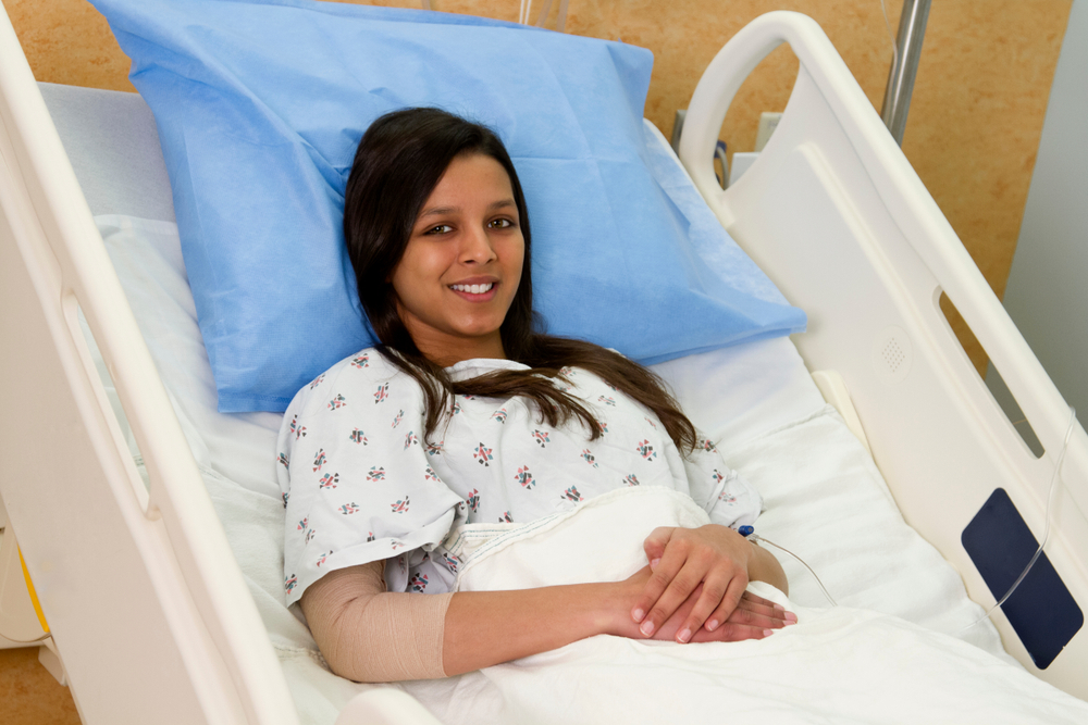 Smiling Teenage girl patient in  Hospital