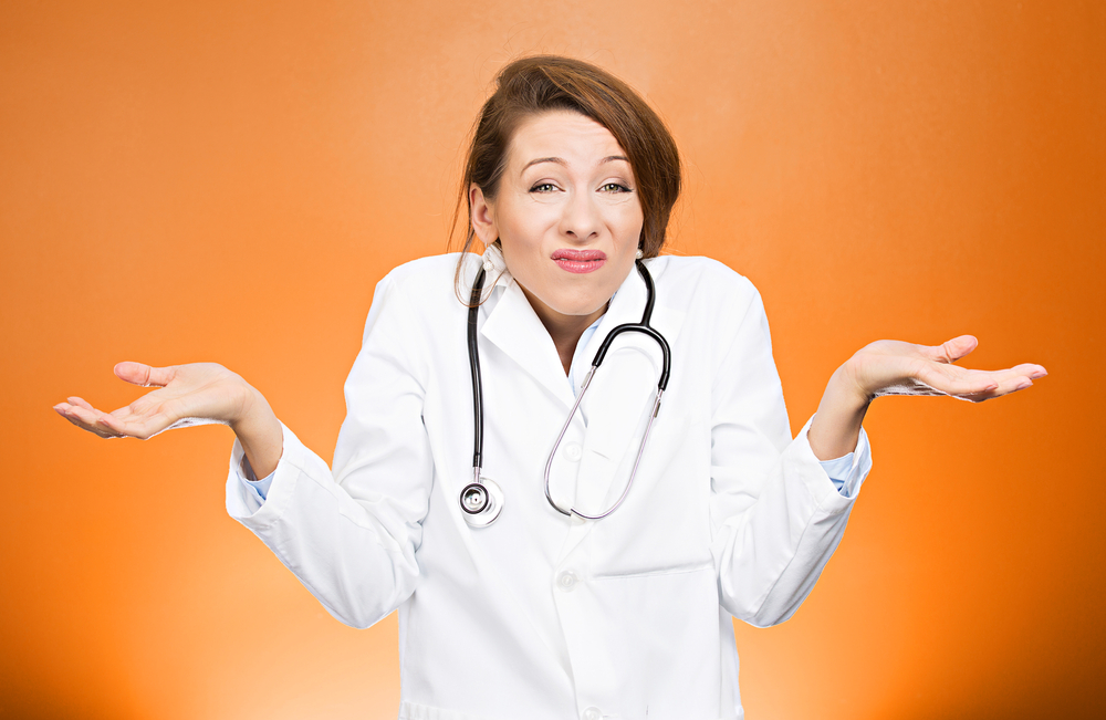 Closeup portrait clueless young health care professional, female physician, family doctor