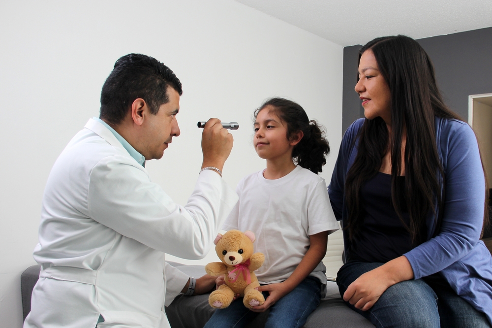little girl and her mother at doctor's office