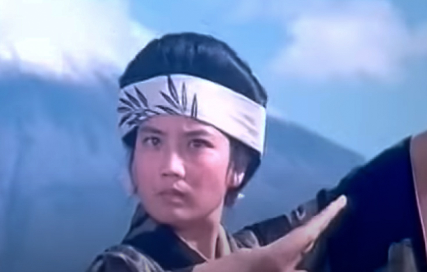 Screenshot: Qiu Jin (Xiuming Li) is practicing martial arts outside - from Qiu Jin (1983)