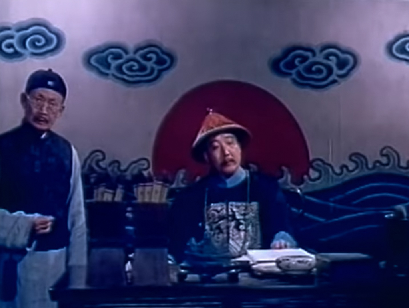 Screenshot: government people in China is talking ,wearing traditional clothes - from Qiu Jin (1983)