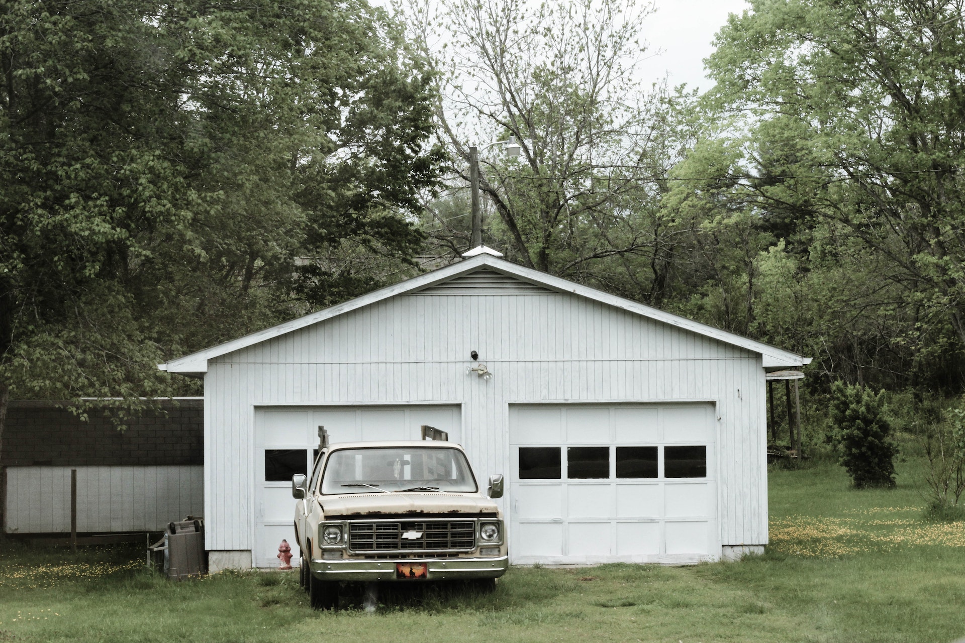 Classic White Chevrolet Pickup Truck Near White 2-door Garage