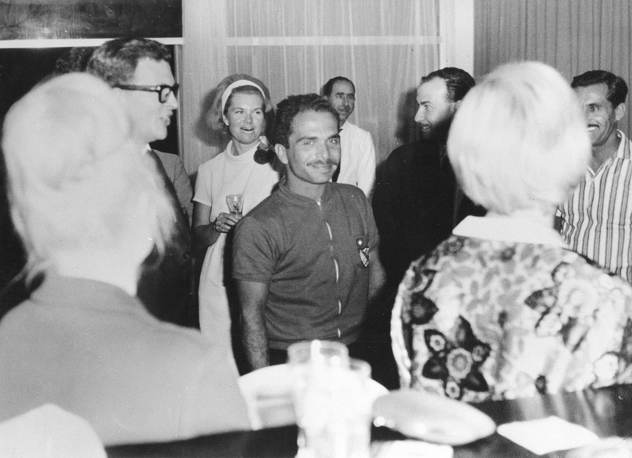 Hussein I of Jordan smiling at party - 1964