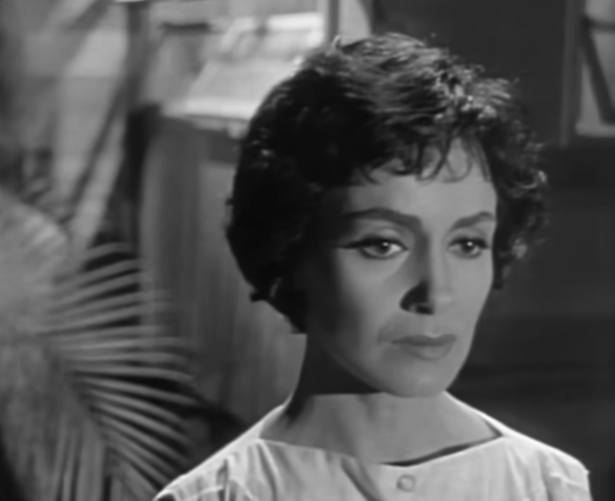 Screenshot: Susan Cabot is looking at side with upset face - from Surrender - Hell! (1959).