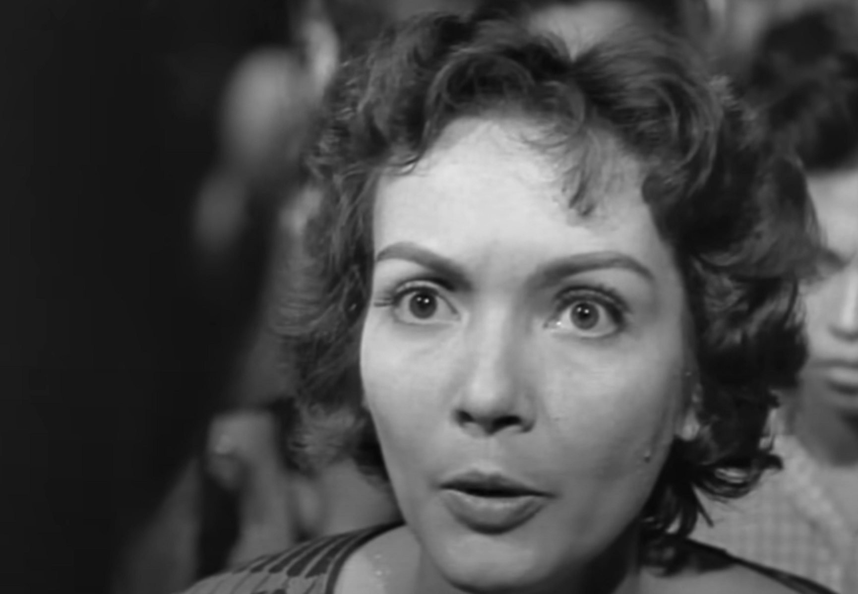 Screenshot: Susan Cabot is looking at camera with upset face - from Surrender - Hell! (1959)