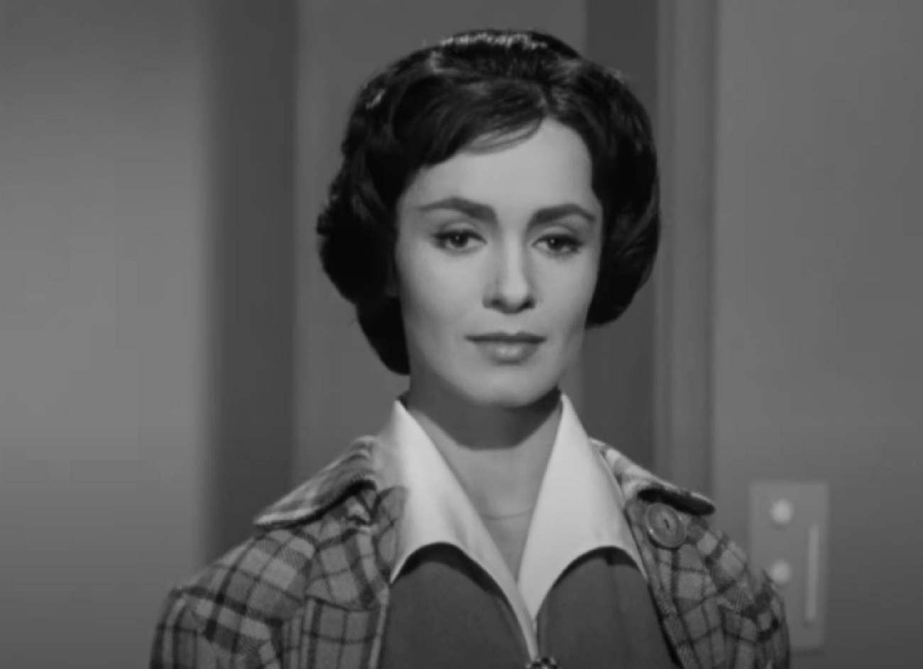 Screenshot: Susan Cabot is looking down with sad face - from The Wasp Woman (1959).