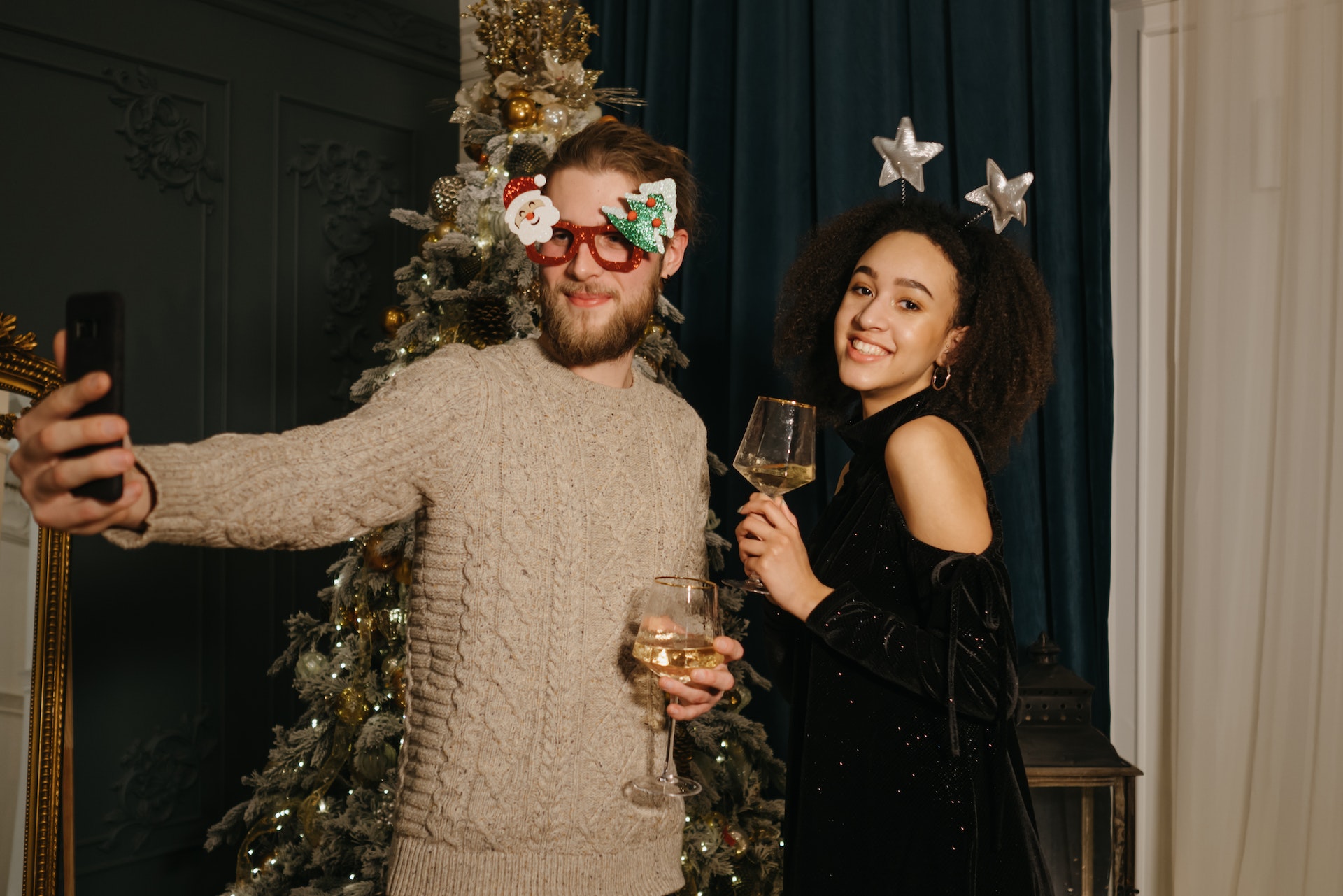 Couple at a Christmas party at home
