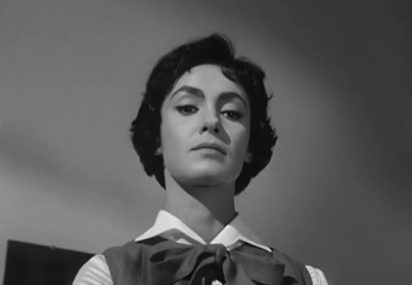 Screenshot: Susan Cabot is looking down with angry face - from Sorority Girl (1957).