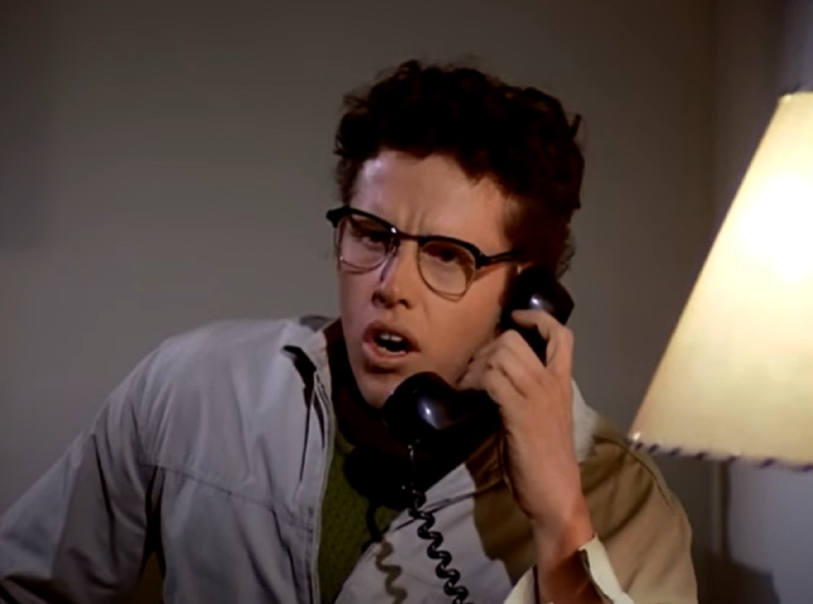 Screenshot: Buddy Holly is talking on the phone with upset face - from The Buddy Holly Story (1978)