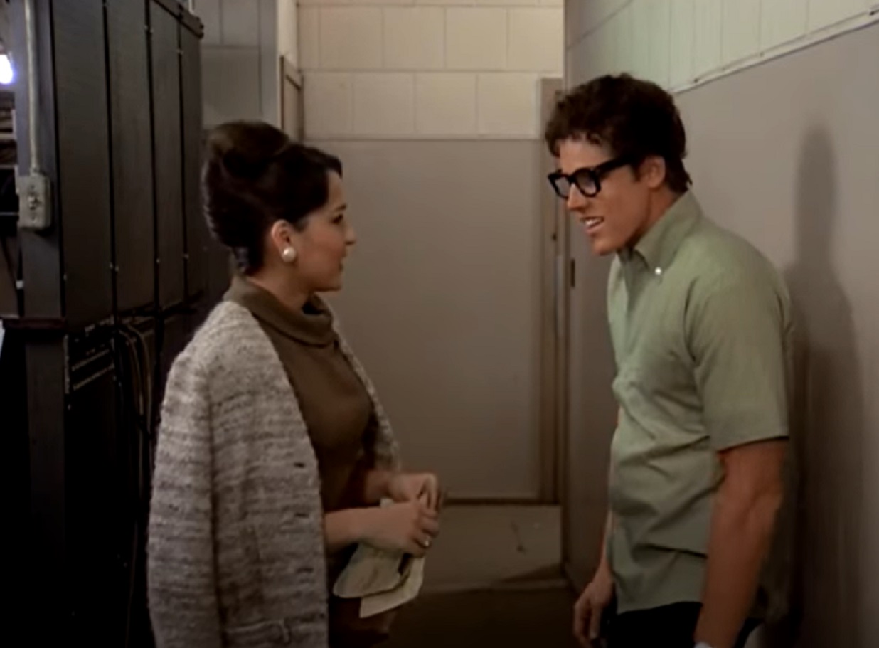 Screenshot: Buddy Holly is talking with his wife Maria at hallway - from The Buddy Holly Story (1978).