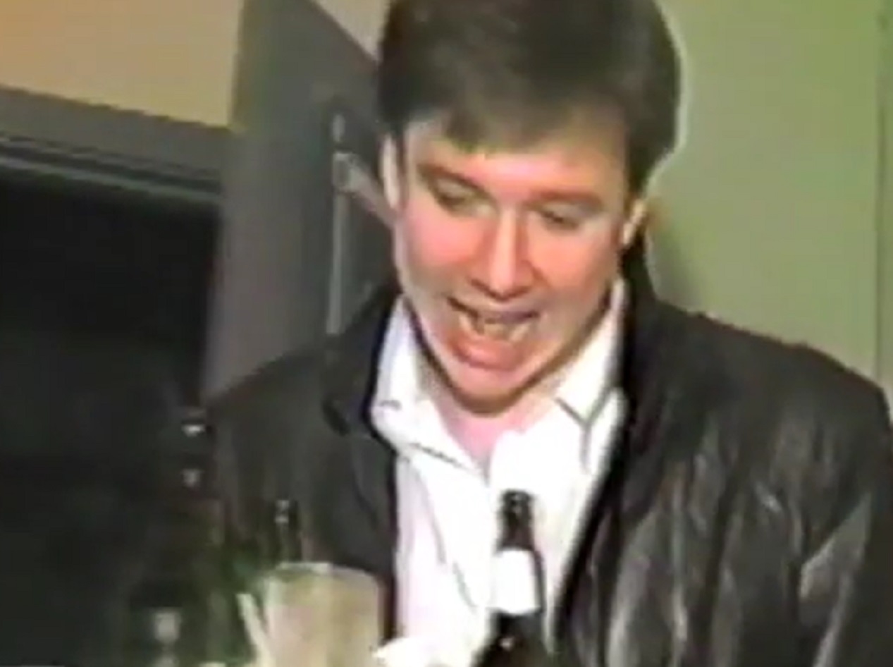 Screenshot: Bill Hicks is smiling at hotel room - from American- The Bill Hicks Story (2009)