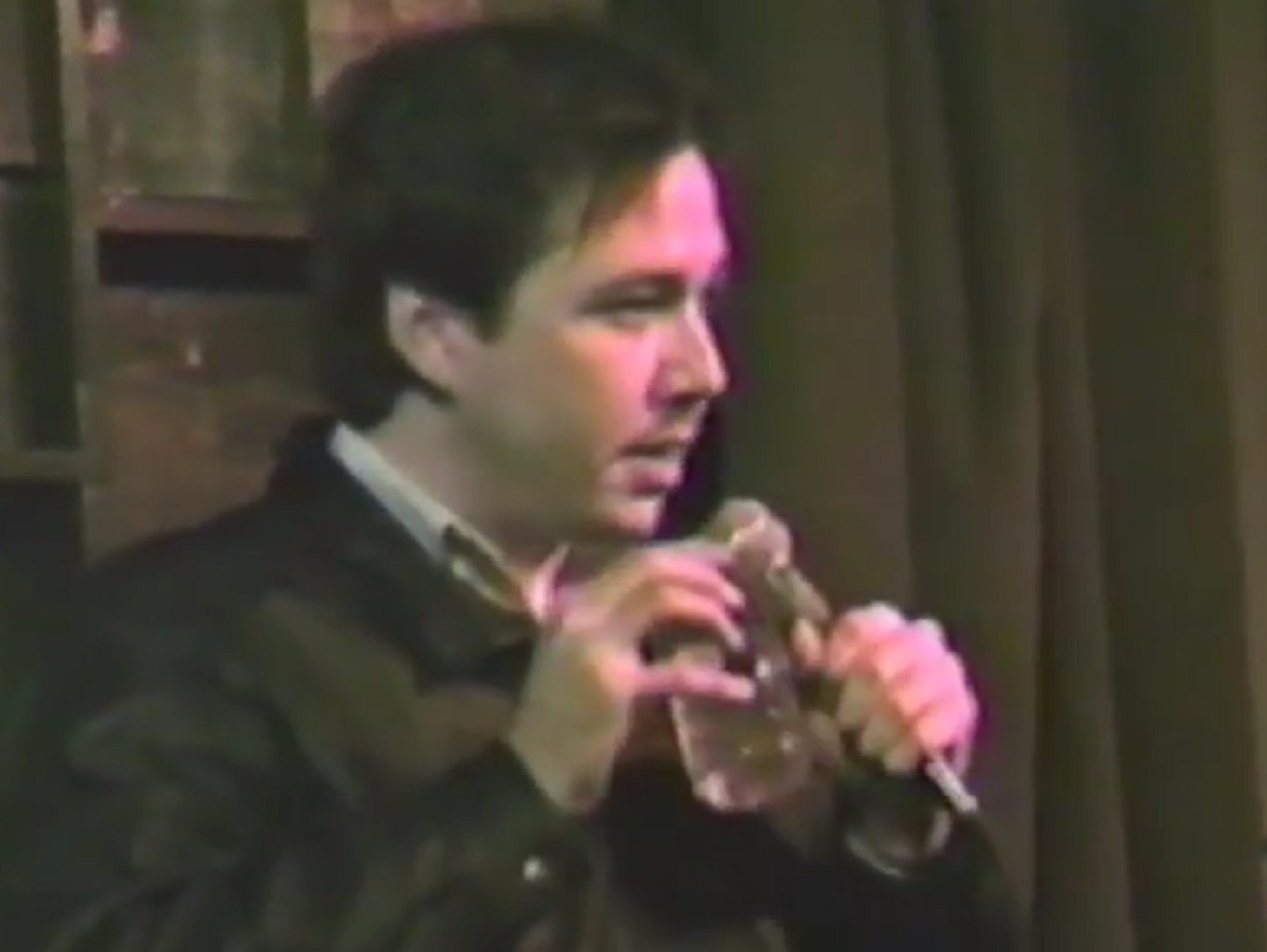Screenshot: Bill Hicks is performing on stage - from American- The Bill Hicks Story (2009).
