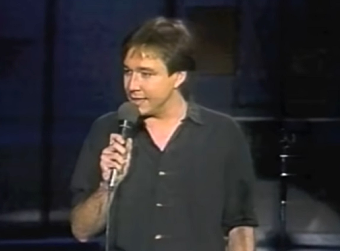 Screenshot: Bill Hicks is performing on stage looking at side - from Late Night With David Letterman (1982-93).