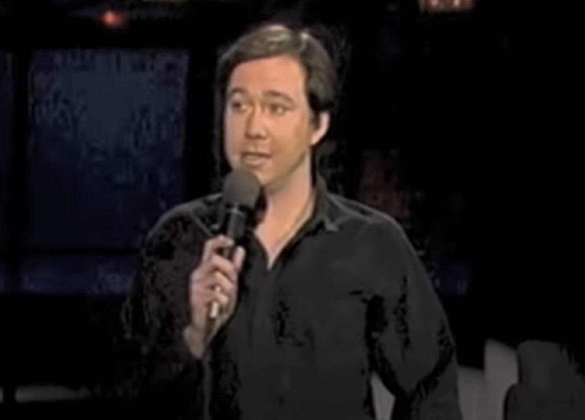Screenshot: Bill Hicks wearing black shirt is looking at side - from Late Night With David Letterman (1982-93)