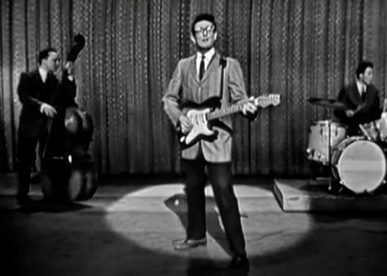 Screenshot: Buddy Holly is performing live with his band - from The Ed Sullivan Show (1948-1971)