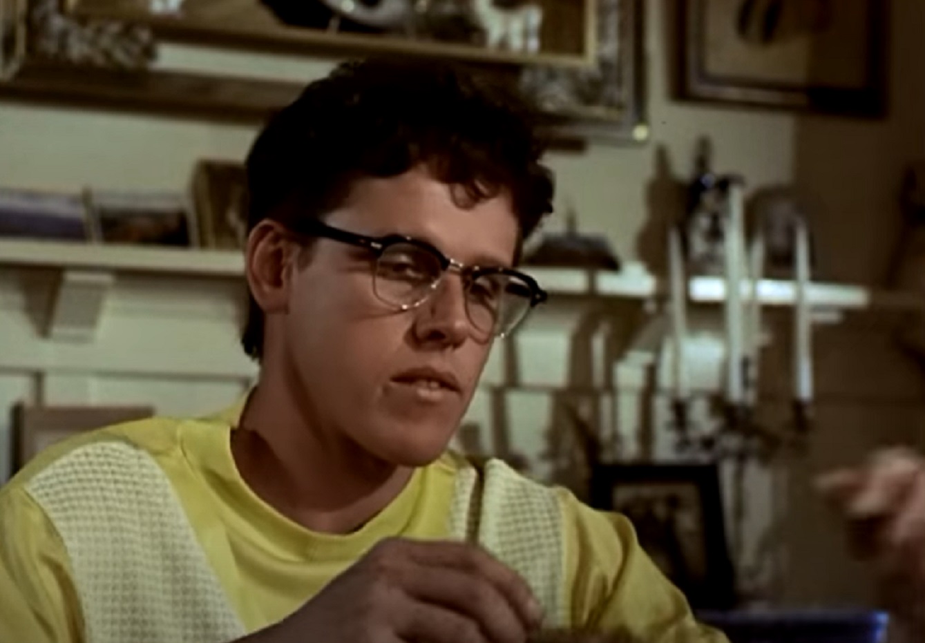 Screenshot: Buddy Holly wearing yellow shirt is looking down - from The Buddy Holly Story (1978).