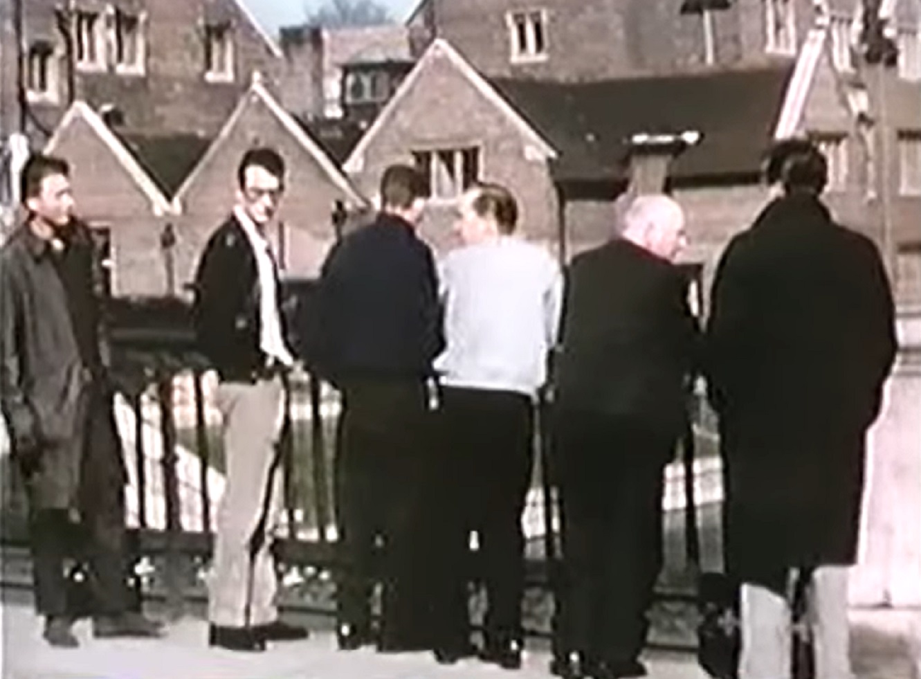 Screenshot: Buddy Holly is walking with his band on the street - from The Real Buddy Holly Story (1985).