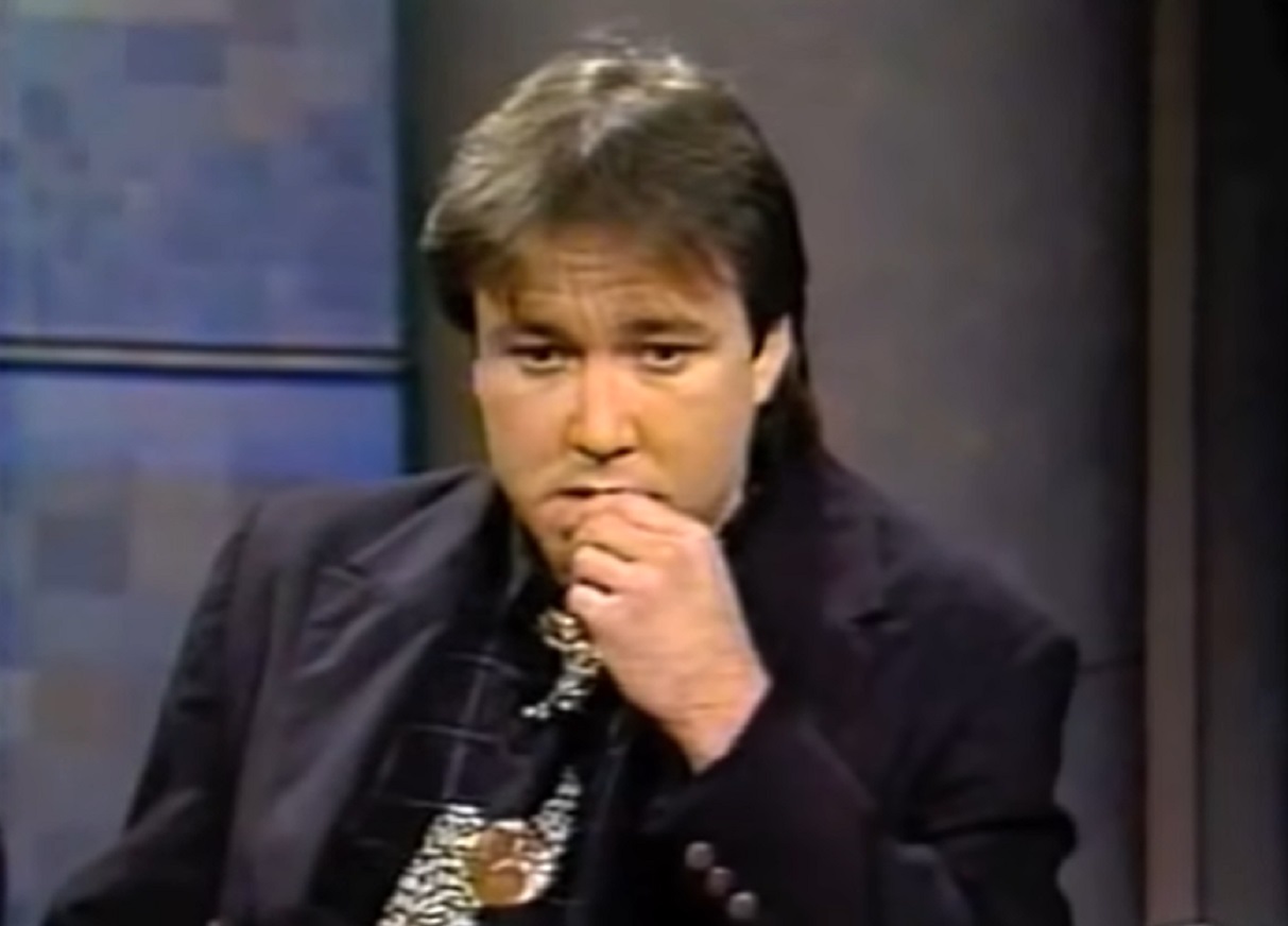 Screenshot: Bill Hicks is seating and looking sad - from Late Night With David Letterman (1982-93)