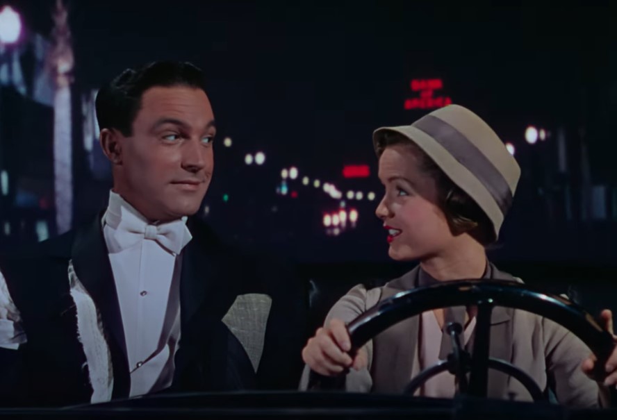Gene Kelly  and Debbie Reynolds in  Singin' in the Rain in a car driving
