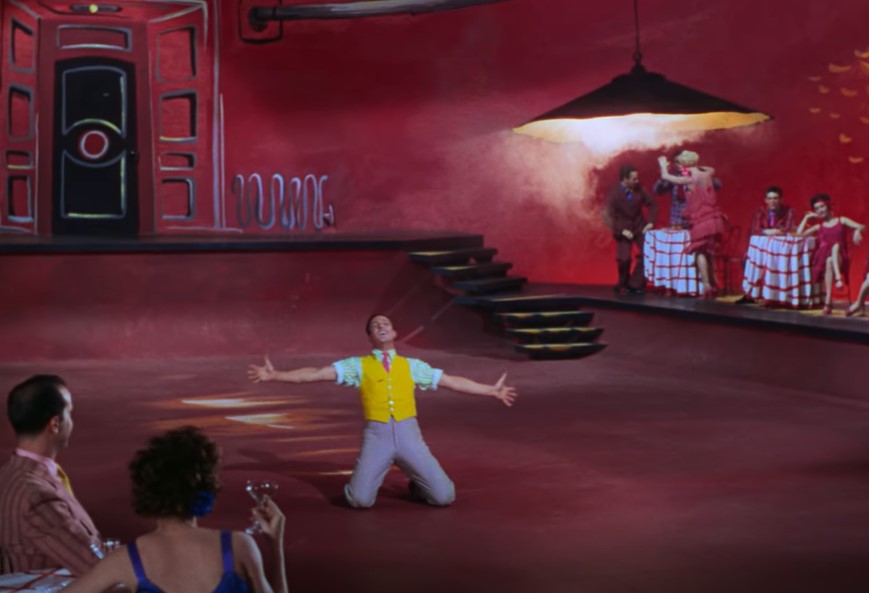 gene kelly  in singin' in the rain dancing on stage