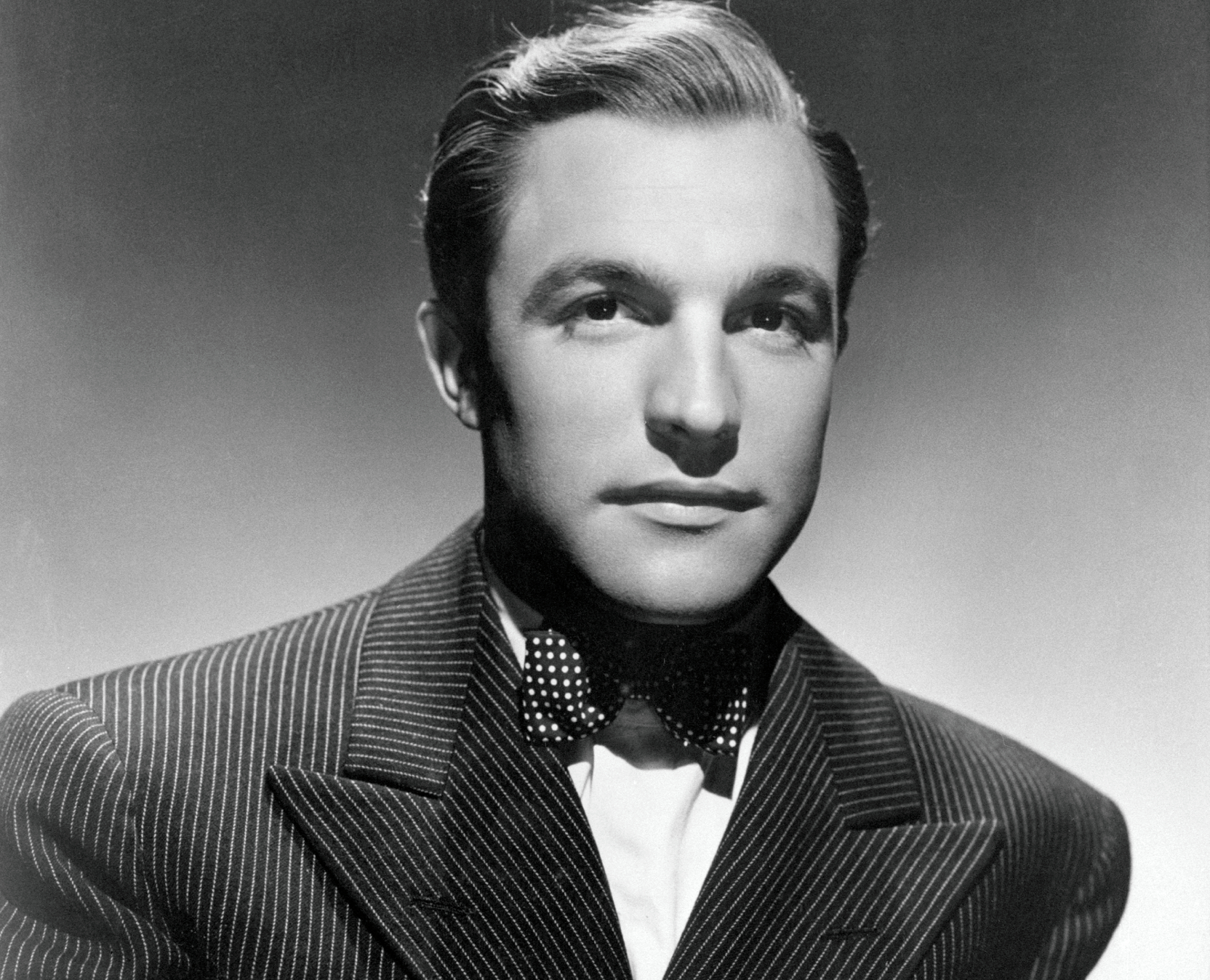 Gene Kelly in black suit and bow tie