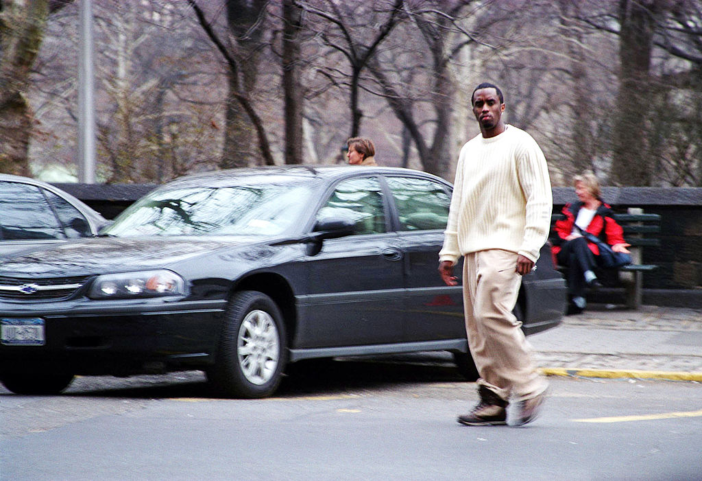 Sean P. Diddy Combs walks by car
