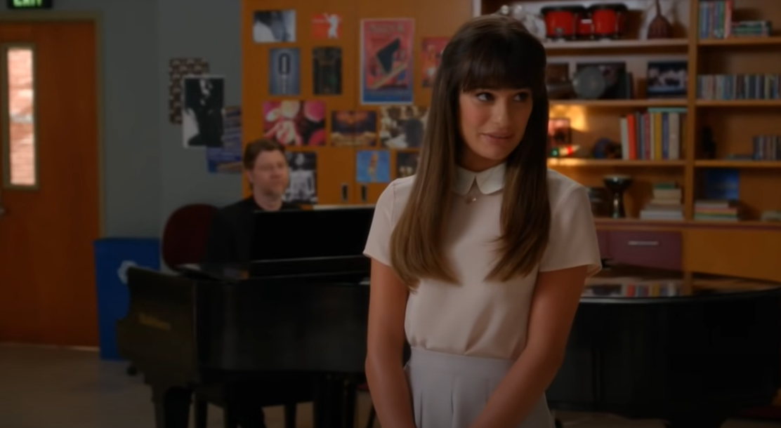 Lea Michele as Rachel Berry in white at school