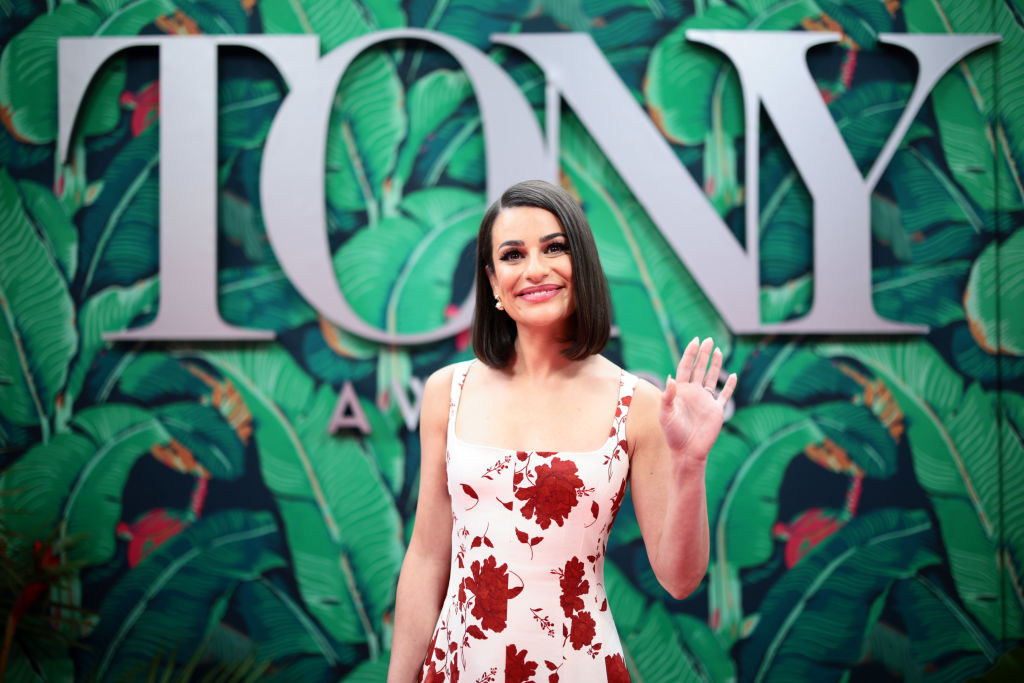Lea Michele attends The 76th Annual Tony Awards in red and white floral dress
