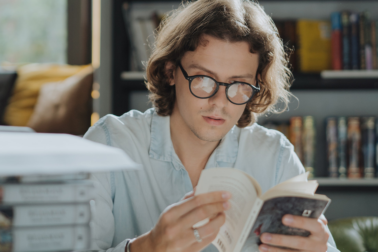 Man Reading In A Bookstore