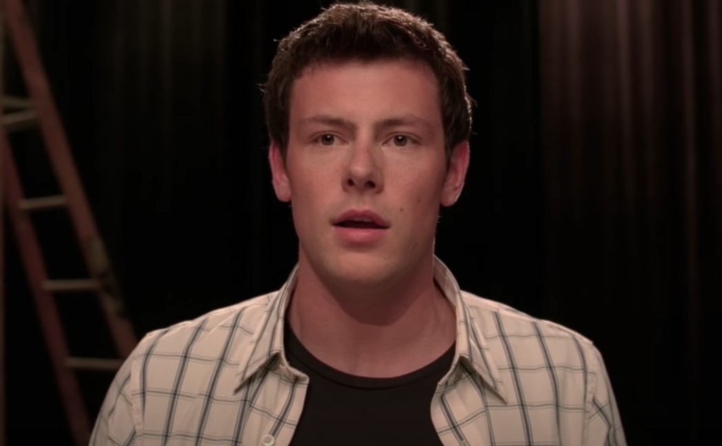 Cory Monteith in glee wearing plaid shirt, singing