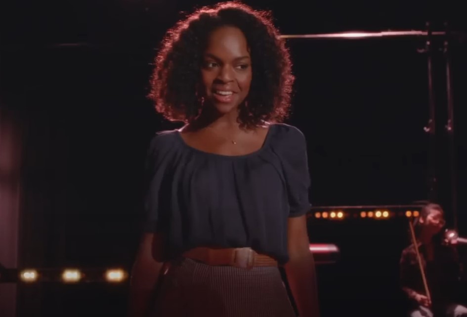 Samantha Ware in glee performing on stage in blue top