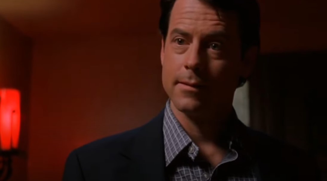 Greg Kinnear  as  Bob Crane in suit
