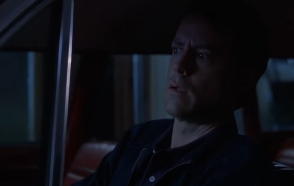 Greg Kinnear  as  Bob Crane in a car