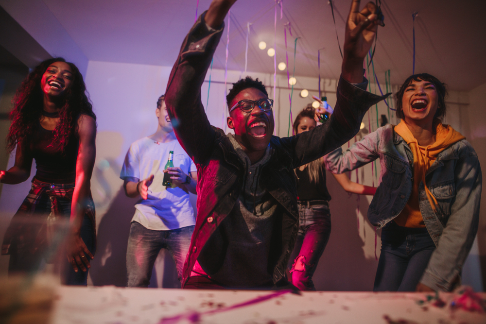 Young men and women dancing at a party