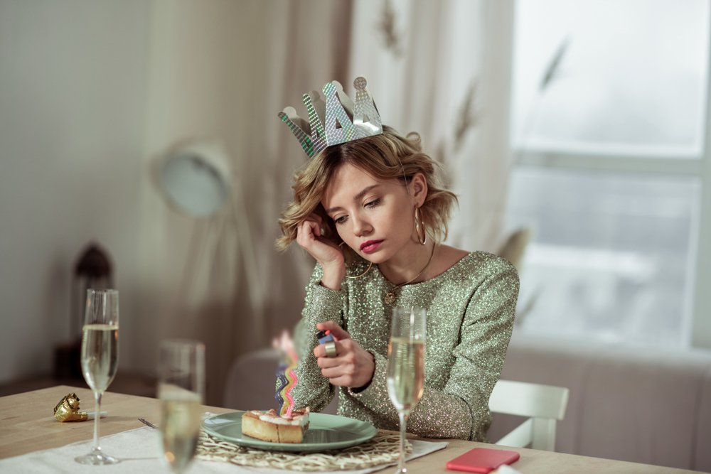 Lonely woman at her birthday in green dress