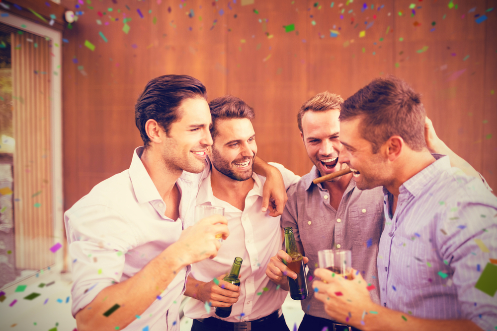 Group of young men having drinks