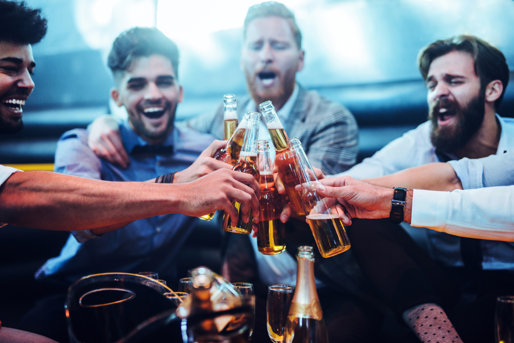Group of men toasting with beer