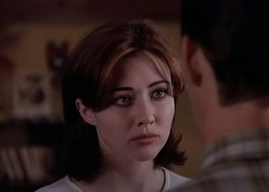 Shannen Doherty as Brenda Walsh in white top