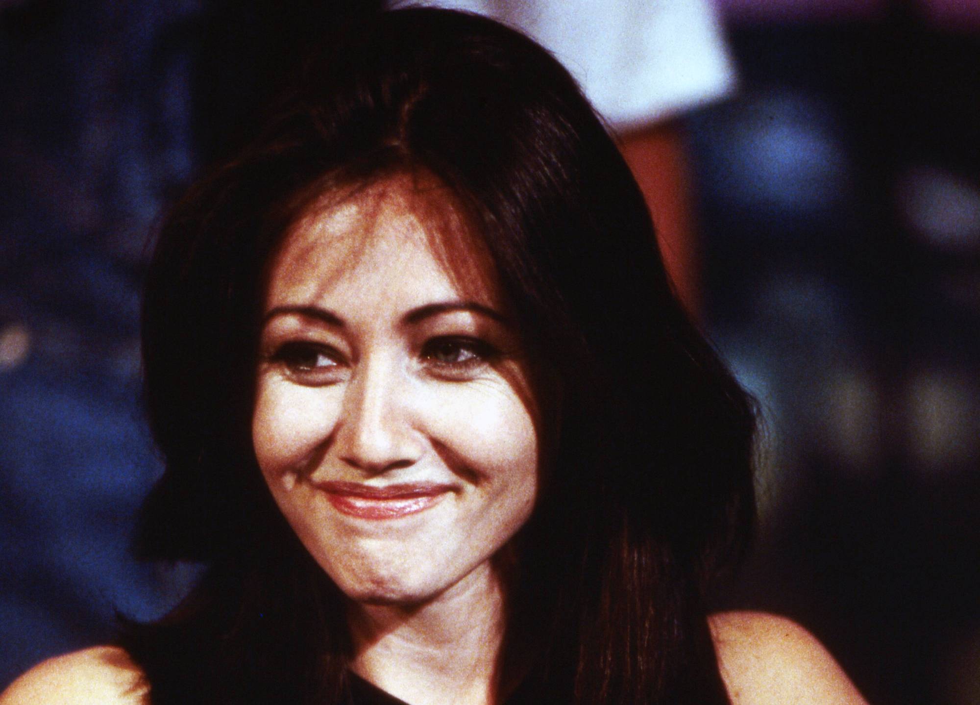 shannen doherty in black top smiling
