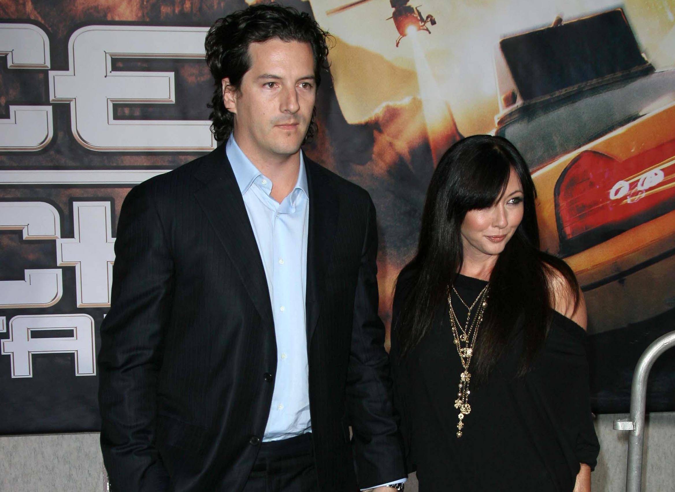 Shannen Doherty with her husband in black casual wear