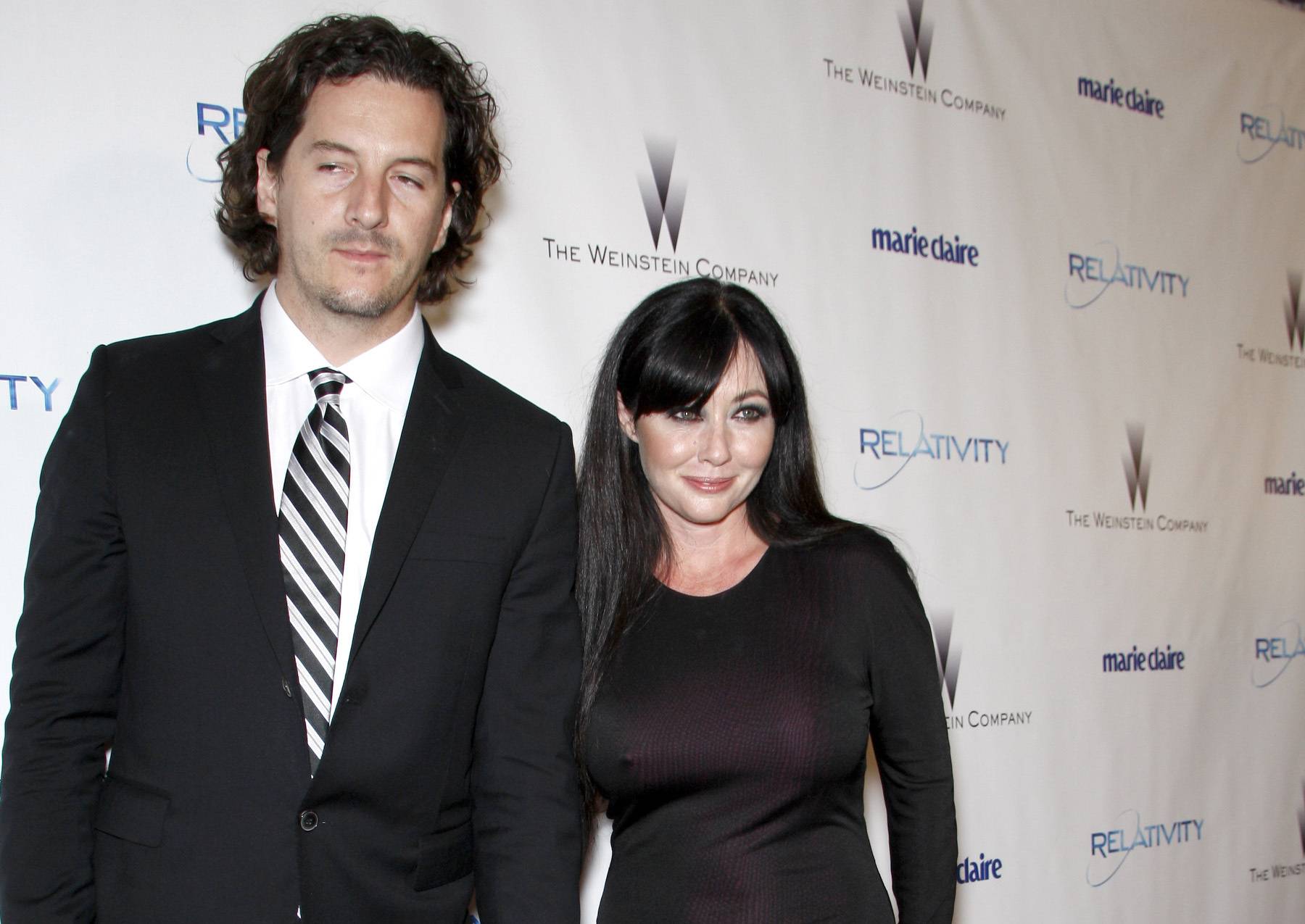 Kurt Iswarienko, Shannen Doherty in black arriving at an event
