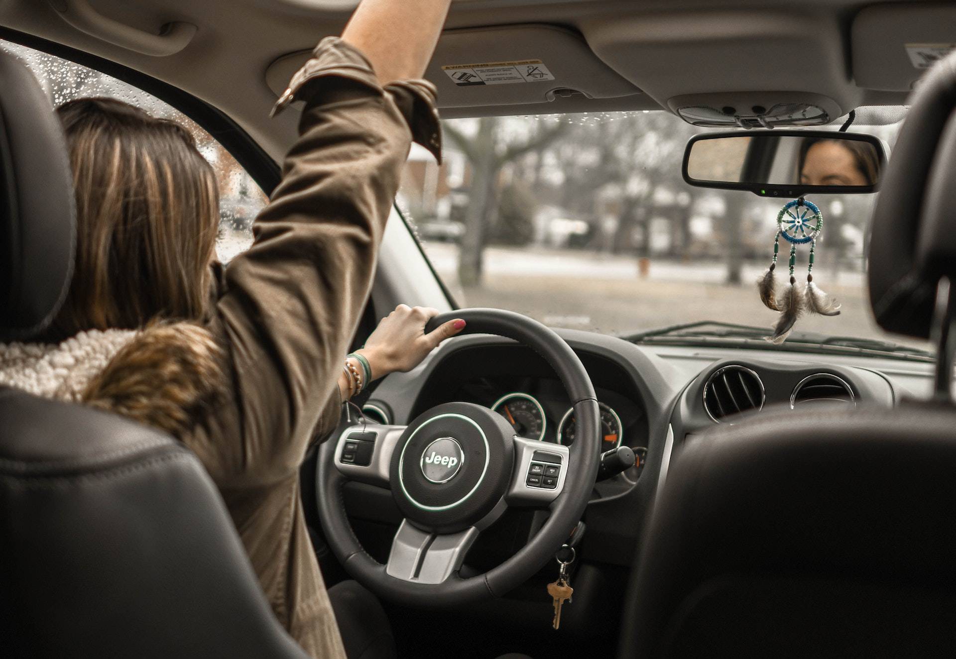 woman driving a car singing
